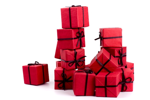 Stack of red gift boxes on white background