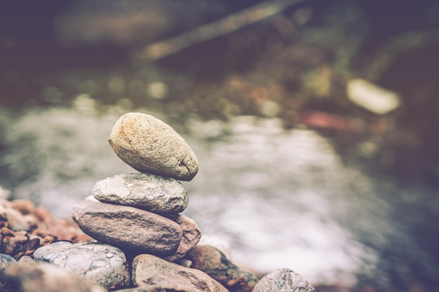 Photo stack of rocks by river