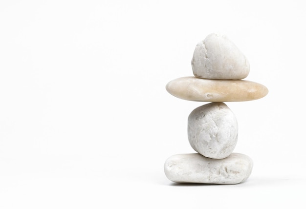 A stack of rocks with the words " happy " on the top.