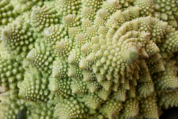 Stack of romanesco broccolis on a market stall