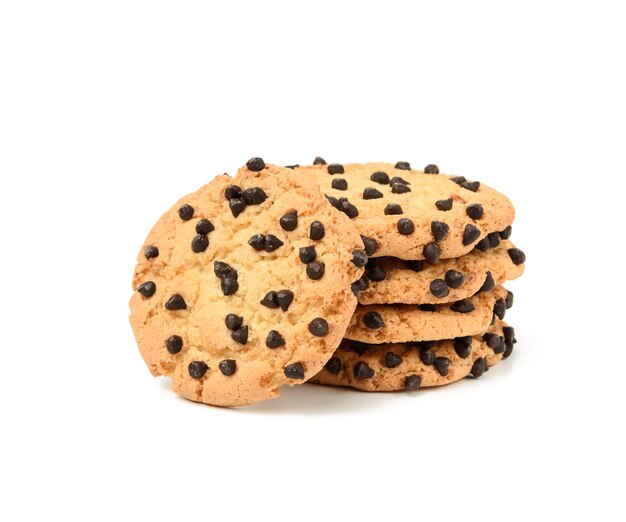 Stack of round baked cookies with chocolate pieces isolated on white background, close up