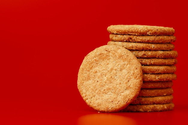 Stack of round oat cookies on paper background