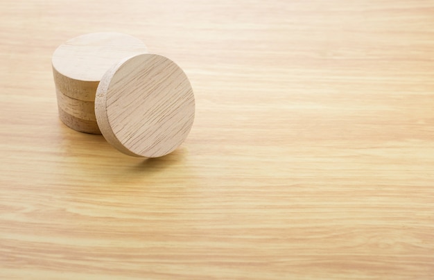 Stack of round wooden block on wood table top