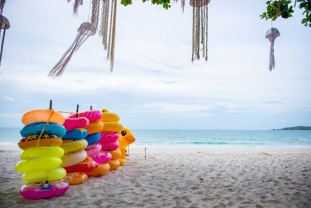 Stack of rubber ring for people to play in the sea on a beach