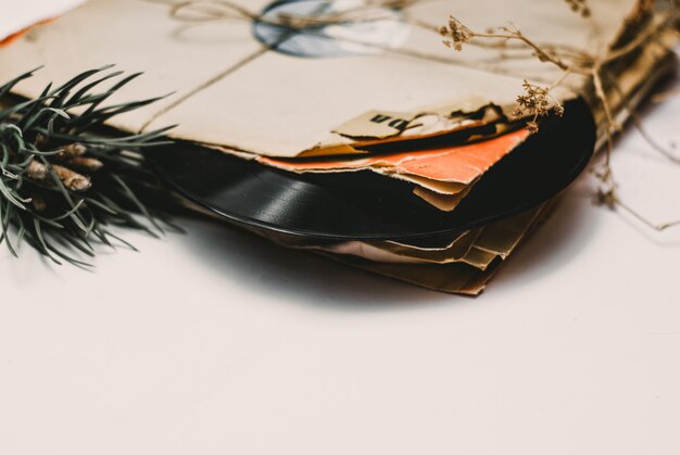 Stack of scratched dusty old vinyl records tied with rope