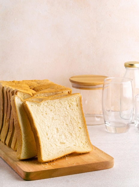 Stack of slice bread isolated on bright background with negative space