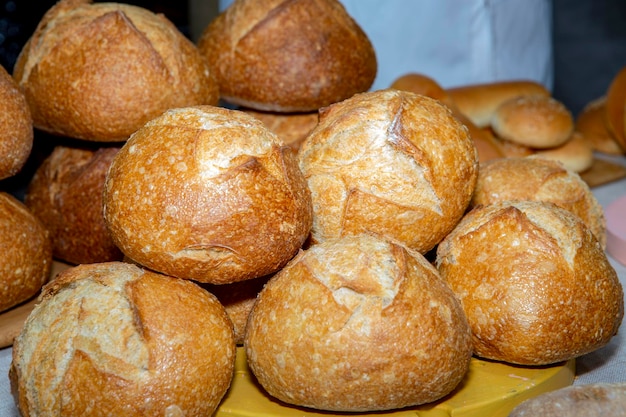 Stack of small loaves on display for sale