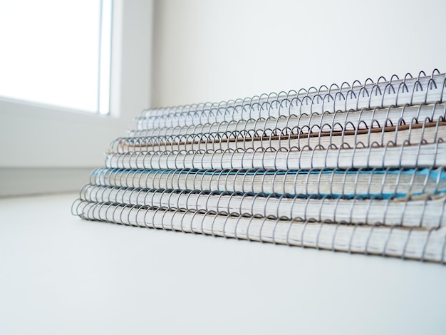 A stack of spring notebooks Thick notebooks or notebooks placed on top of each other Education