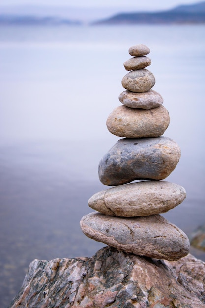 stack of stones on the beach. Various stones top view on the beach. Stone Tower, Land Art,balance.