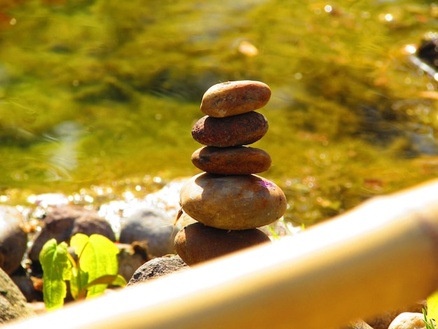 Photo stack of stones on lakeshore