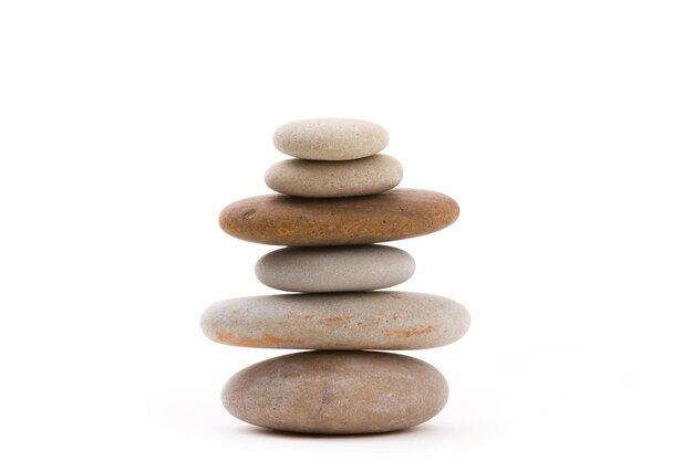 Stack of stones on white background