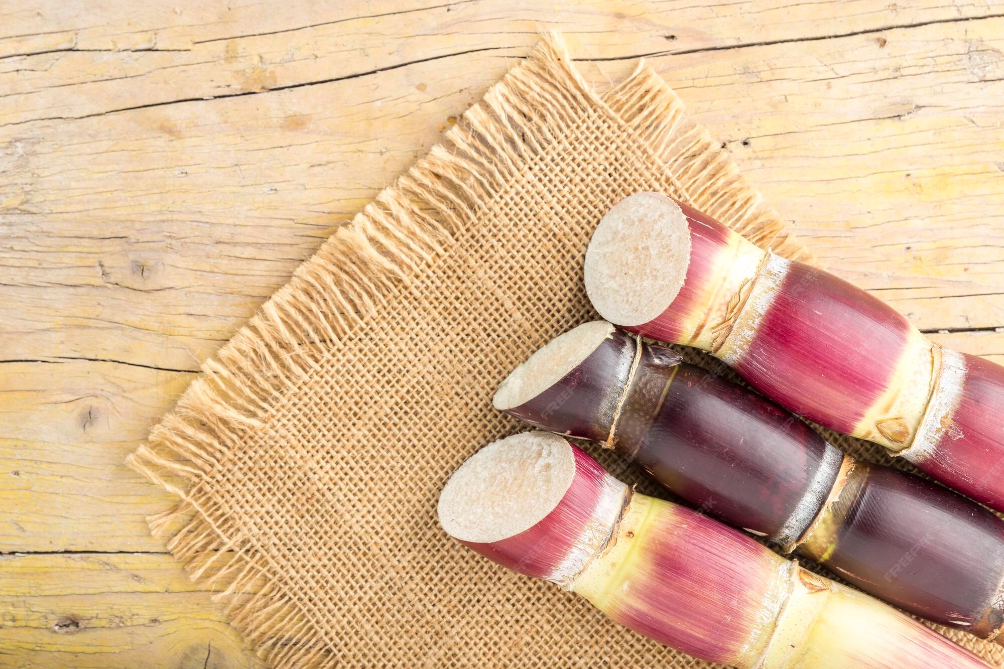 Premium Photo Stack of sugar cane on the table