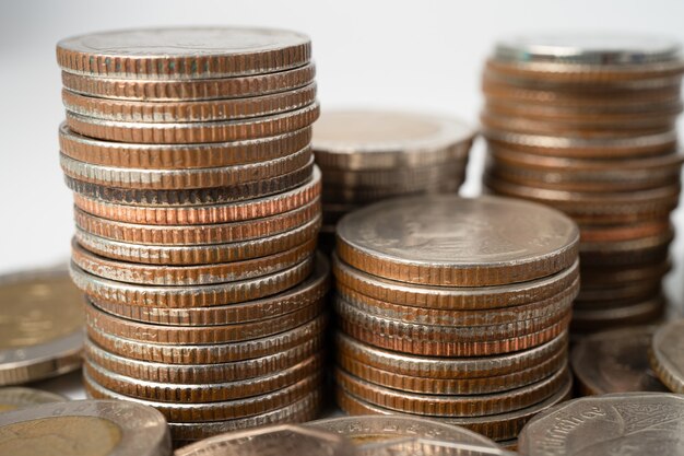 Stack of Thai baht coins on white background, Business finance investment concept.