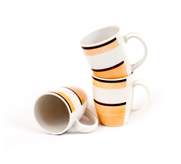 Stack of three mugs isolated