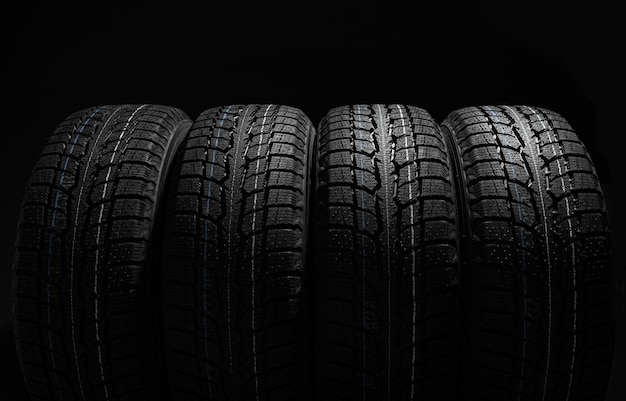 Stack of tires on black background