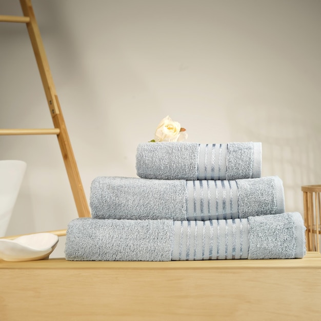 a stack of towels with a ladder on top of them that says quot the one is made of towels quot towels