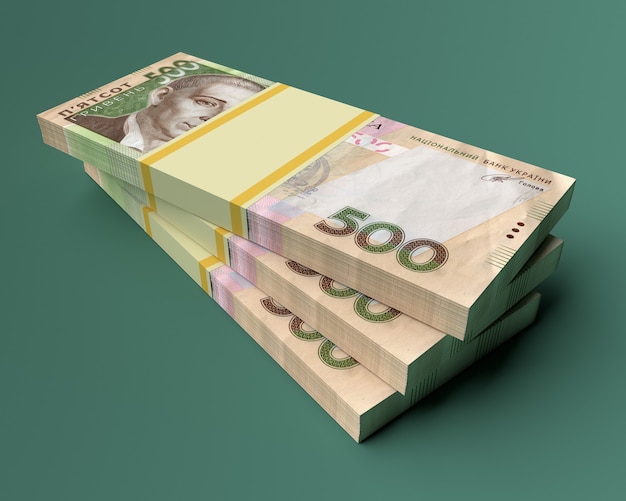 Stack of ukrainian money hryvnia on green  background