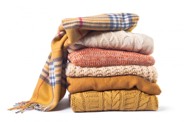Photo stack of various sweaters isolated