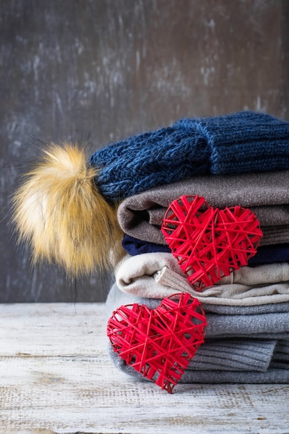 Stack of warm knitted clothes