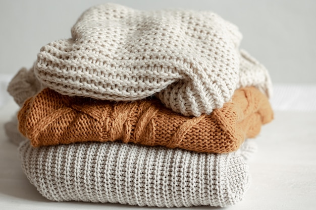 A stack of warm knitted sweaters