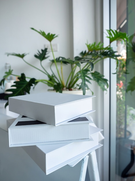 Stack of white books on white shelf