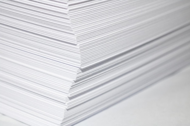 Stack of white paper close up copy space