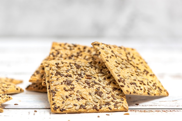 stack of whole grain biscuits on light.