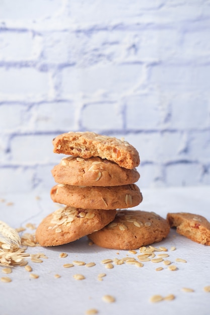 Stack of whole meal cookies on wooden background