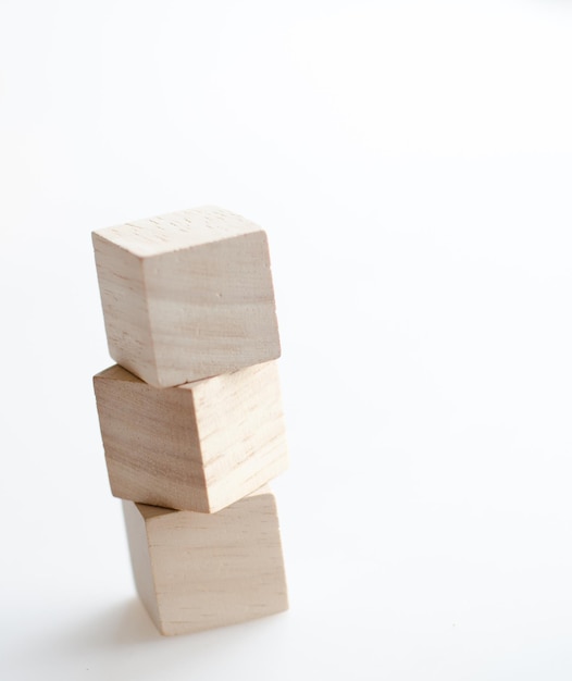 Stack of wooden blocks against white background