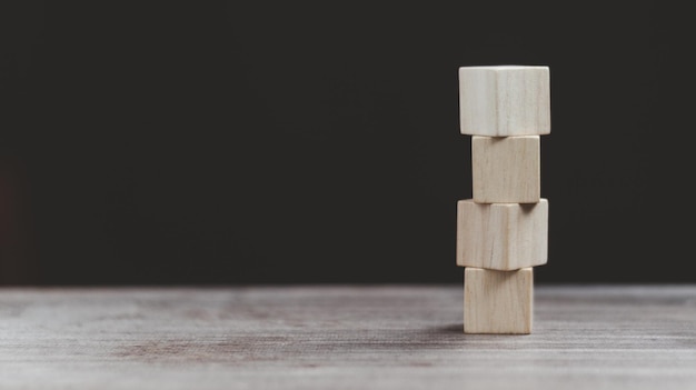 Stack wooden blocks on a dark background