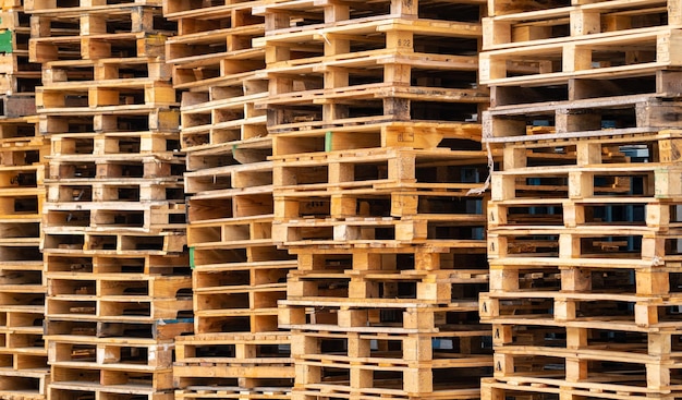 Stack of wooden pallet Industrial wood pallet at factory warehouse Cargo and shipping concept