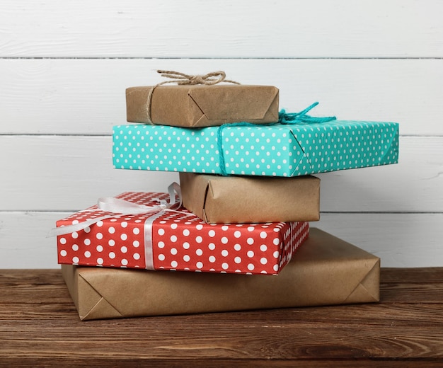 Stack of wrapped gifts on table