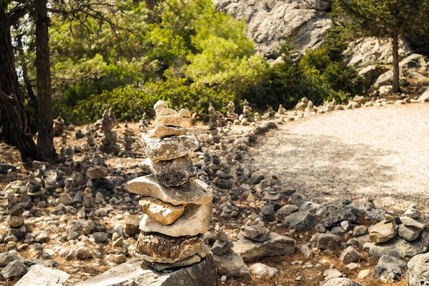 Stack of zen stonesStack of stones on top of the mountain Pile of rocks stone and mountains Balanced stone for meditation Zen likeyoga calming the mind and relaxation concept