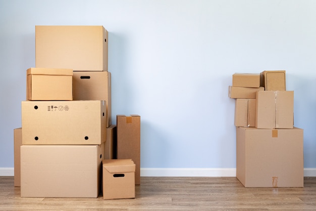 Stacked cardboard boxes in a room