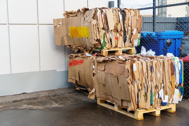 Stacked cardboard and paper products for further processing A waste paper recycling company Paper garbage at the recycling plant Separate garbage collection