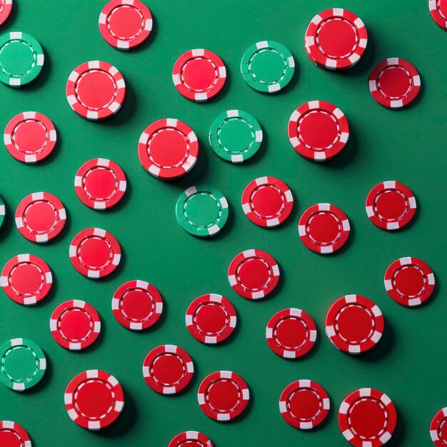 Stacked casino tokens on green background