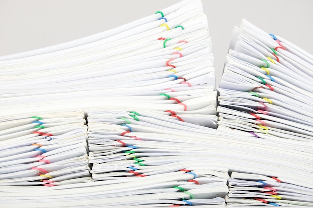 stacked files against gray background