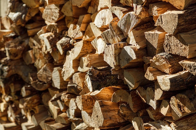 Stacked firewood under the wall