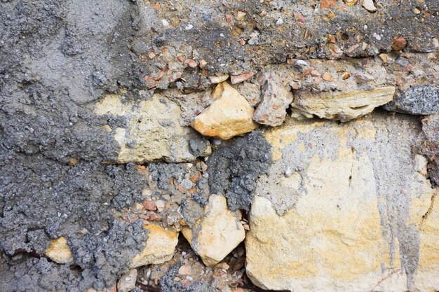 Fondo naturale impilato della parete della roccia del campo