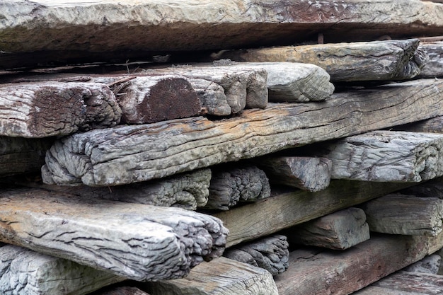 Stacked old train track planks