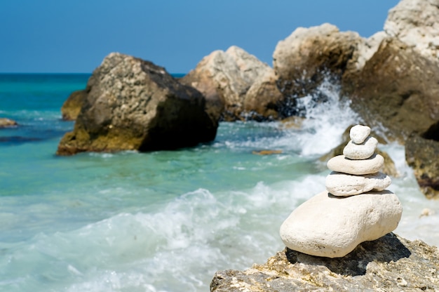 Stacked pebbles on rocky beach