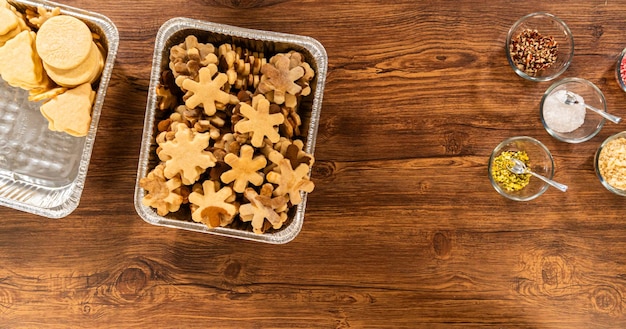 Stacked snowflake cookies in warm tones