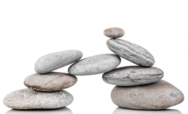 Photo stacked stones on white isolated