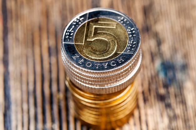 Stacked together metal cash coins, close-up of Polish money