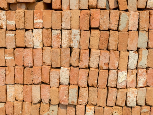 Photo stacked used clay brick for reuse