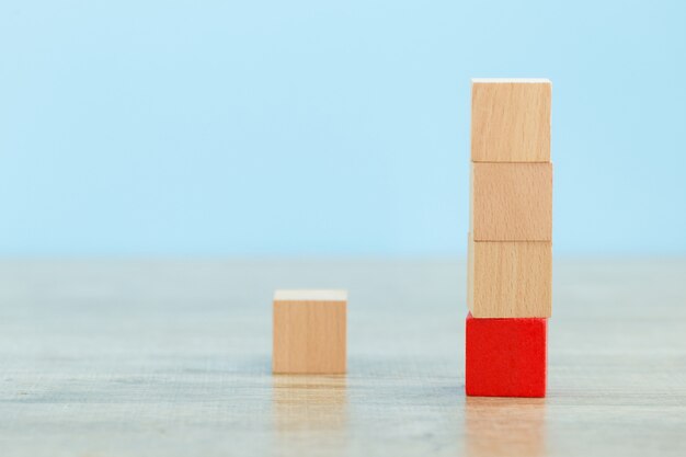 stacking wooden blocks into steps,concept of business growth success