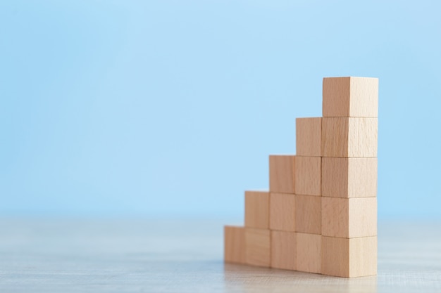 Stacking wooden blocks into steps,Concept of business growth success