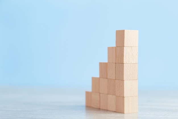 Stacking wooden blocks into steps,Concept of business growth success