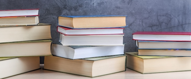 Photo stacks of books on a gray background