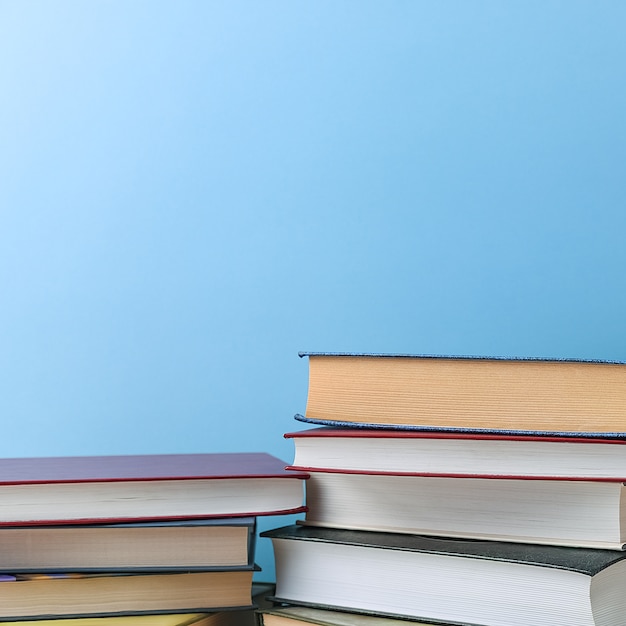 Stacks of books several on a blue